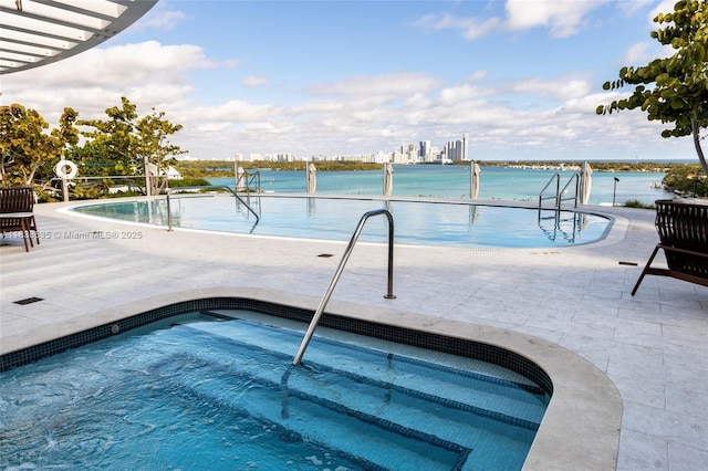 1135 103rd St Unit 702, Bay Harbor Islands, FL 33154 - community pool featuring a hot tub and a patio