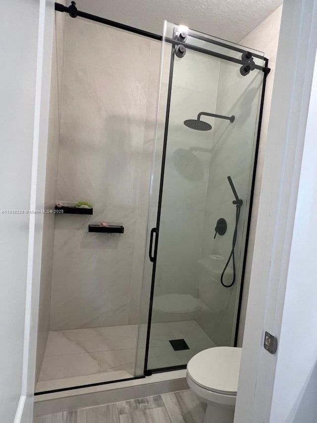 8813 Antarus Dr Unit 8813, Lake Worth, FL 33467 - bathroom featuring a shower stall and a textured ceiling