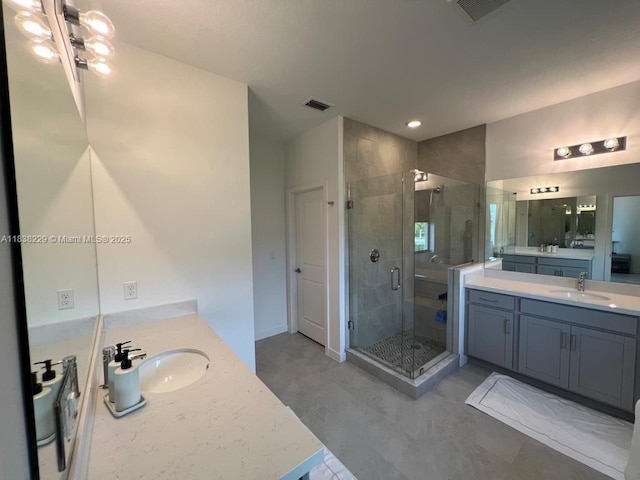 8813 Antarus Dr Unit 8813, Lake Worth, FL 33467 - full bath with a stall shower, two vanities, and recessed lighting