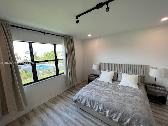 8813 Antarus Dr Unit 8813, Lake Worth, FL 33467 - bedroom featuring wood finished floors, recessed lighting, and rail lighting