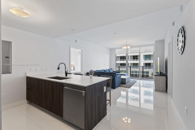 488 NE 18th St Unit 509, Miami, FL 33132 - kitchen featuring electric panel, light countertops, a chandelier, a peninsula, and dark brown cabinets