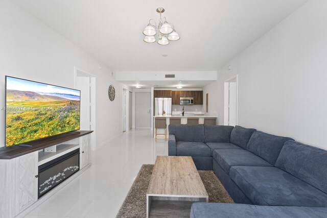 488 NE 18th St Unit 509, Miami, FL 33132 - tiled living room featuring a chandelier