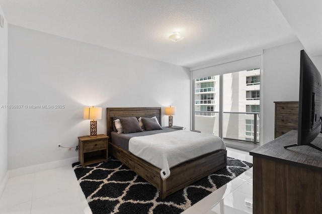 488 NE 18th St Unit 509, Miami, FL 33132 - bedroom featuring baseboards and tile patterned flooring
