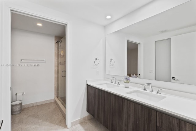 488 NE 18th St Unit 509, Miami, FL 33132 - full bathroom featuring double vanity, a stall shower, recessed lighting, and tile patterned floors