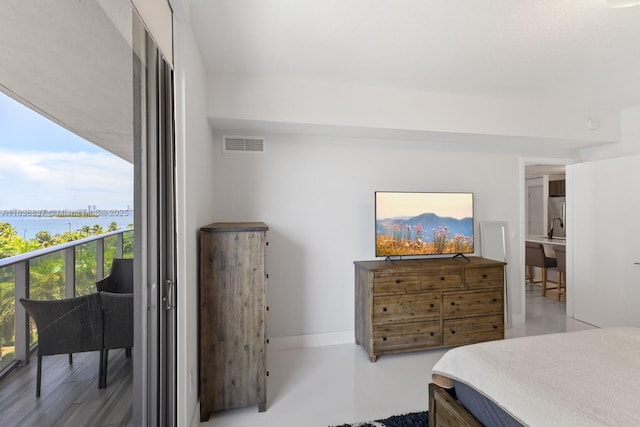 488 NE 18th St Unit 509, Miami, FL 33132 - bedroom featuring a water view and freestanding refrigerator