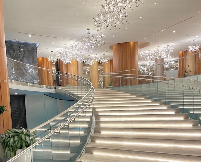 488 NE 18th St Unit 509, Miami, FL 33132 - stairway featuring a chandelier and a high ceiling