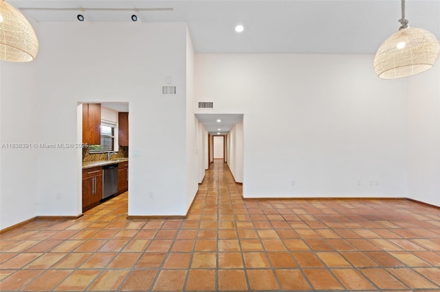 2794 SW 22nd Ave, Miami, FL 33133 - unfurnished room featuring a high ceiling, light tile patterned floors, and recessed lighting