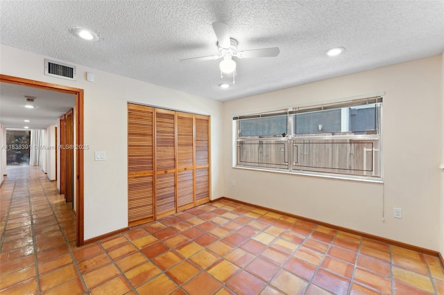 2794 SW 22nd Ave, Miami, FL 33133 - unfurnished bedroom with a closet, a textured ceiling, tile patterned flooring, recessed lighting, and ceiling fan