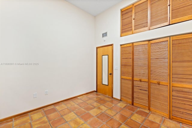 2794 SW 22nd Ave, Miami, FL 33133 - unfurnished bedroom with a closet and a towering ceiling