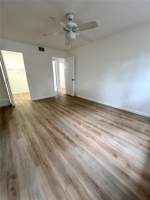 855 Euclid Ave Unit 104, Miami Beach, FL 33139 - unfurnished room with wood finished floors, a ceiling fan, and a textured ceiling
