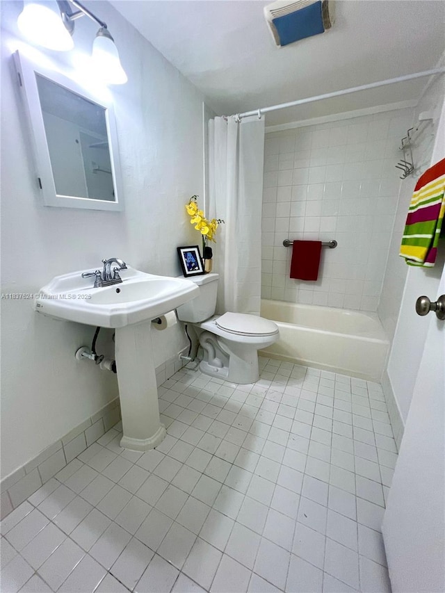 855 Euclid Ave Unit 104, Miami Beach, FL 33139 - full bath featuring tile patterned floors and shower / bath combo with shower curtain