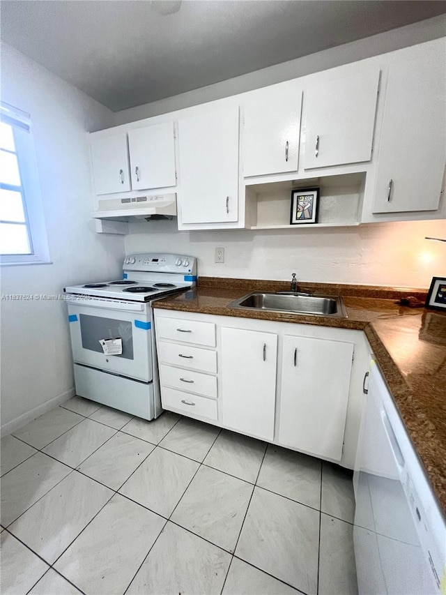 855 Euclid Ave Unit 104, Miami Beach, FL 33139 - kitchen featuring white appliances, under cabinet range hood, white cabinetry, dark countertops, and light tile patterned flooring