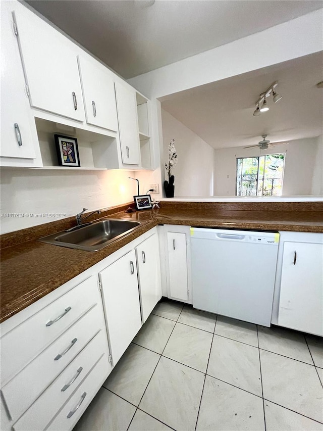 855 Euclid Ave Unit 104, Miami Beach, FL 33139 - kitchen featuring white dishwasher, open shelves, dark countertops, and white cabinets