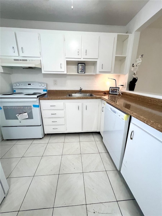 855 Euclid Ave Unit 104, Miami Beach, FL 33139 - kitchen with white appliances, under cabinet range hood, open shelves, white cabinetry, and dark countertops