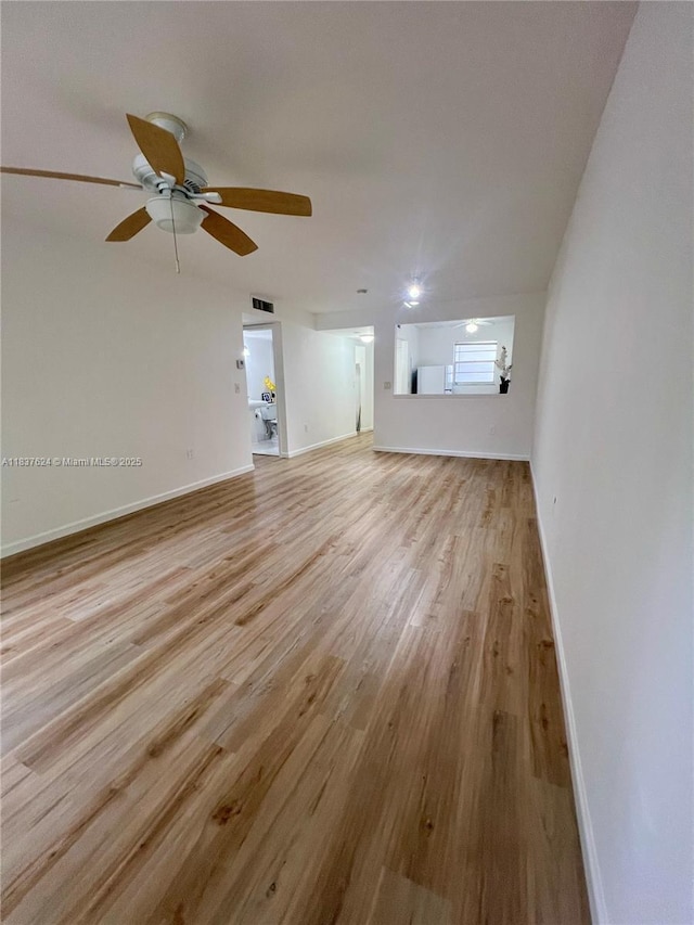 855 Euclid Ave Unit 104, Miami Beach, FL 33139 - unfurnished living room with light wood-style flooring and a ceiling fan
