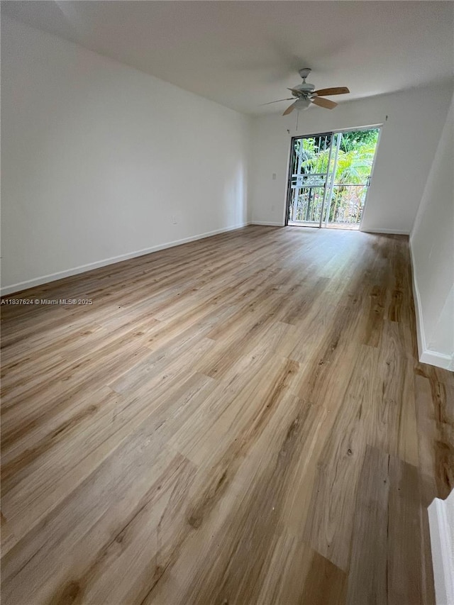 855 Euclid Ave Unit 104, Miami Beach, FL 33139 - empty room with ceiling fan and wood finished floors