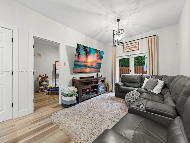 11901 SW 150th Pl, Miami, FL 33196 - living room with a chandelier and light wood-style flooring