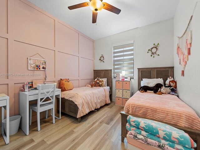 11901 SW 150th Pl, Miami, FL 33196 - bedroom with light wood-style flooring, a decorative wall, and a ceiling fan