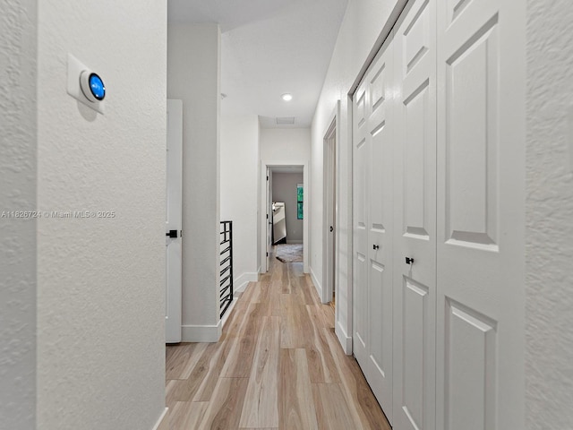 11901 SW 150th Pl, Miami, FL 33196 - hallway featuring a textured wall, light wood finished floors, and recessed lighting
