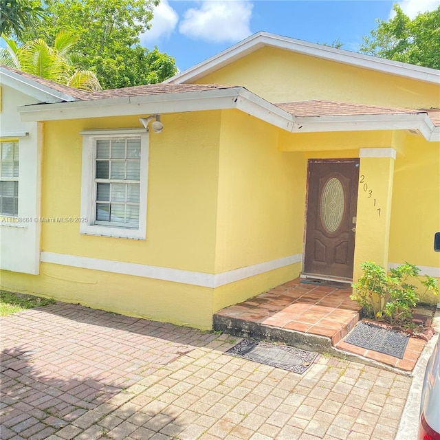 20317 SW 86th Ct, Cutler Bay, FL 33189 - entrance to property with stucco siding and roof with shingles