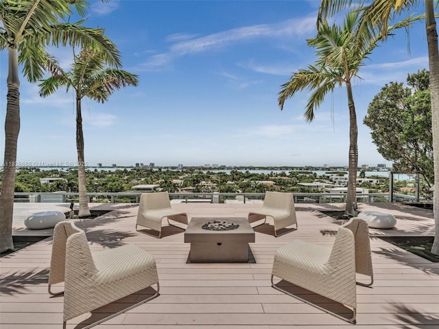 9940 W Bay Harbor Dr Unit 3G-S, Bay Harbor Islands, FL 33154 - wooden terrace with a fire pit