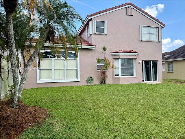 1111 NW 173rd Ave, Pembroke Pines, FL 33029 - back of property with stucco siding, a lawn, and a tile roof