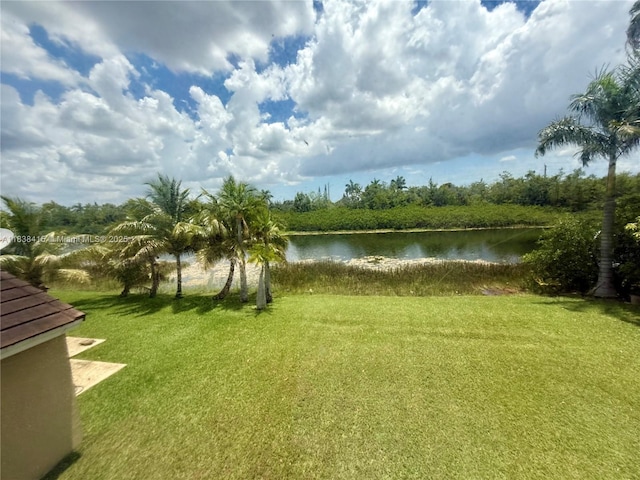 1111 NW 173rd Ave, Pembroke Pines, FL 33029 - view of green lawn featuring a water view