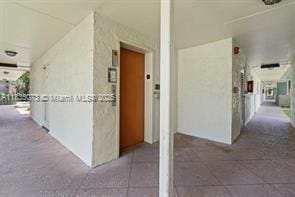 6075 N Sabal Palm Blvd Unit 310, Tamarac, FL 33319 - hallway featuring elevator