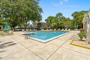 6075 N Sabal Palm Blvd Unit 310, Tamarac, FL 33319 - community pool featuring a patio area