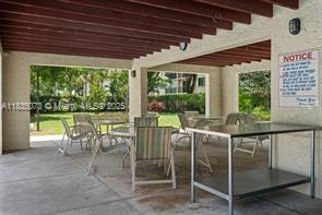 6075 N Sabal Palm Blvd Unit 310, Tamarac, FL 33319 - view of patio with outdoor dining space