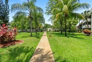 6075 N Sabal Palm Blvd Unit 310, Tamarac, FL 33319 - surrounding community featuring a lawn