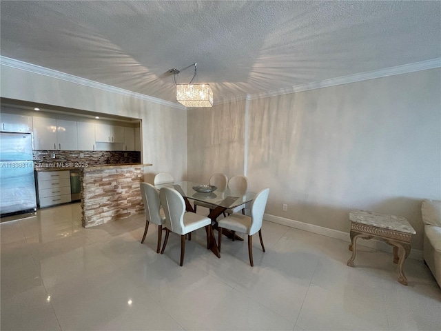 19390 Collins Ave Unit 902, Sunny Isles Beach, FL 33160 - dining space with ornamental molding and a textured ceiling