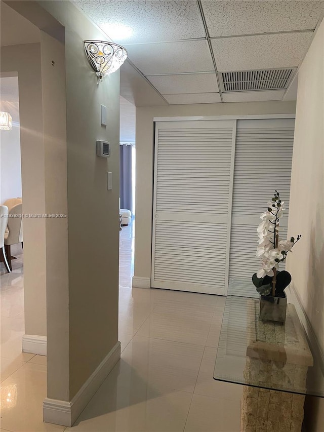 19390 Collins Ave Unit 902, Sunny Isles Beach, FL 33160 - corridor with a paneled ceiling and tile patterned floors