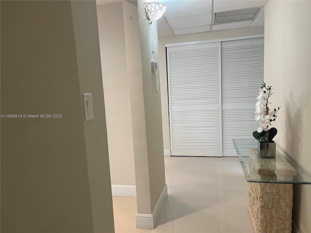 19390 Collins Ave Unit 902, Sunny Isles Beach, FL 33160 - hallway with tile patterned floors and a drop ceiling