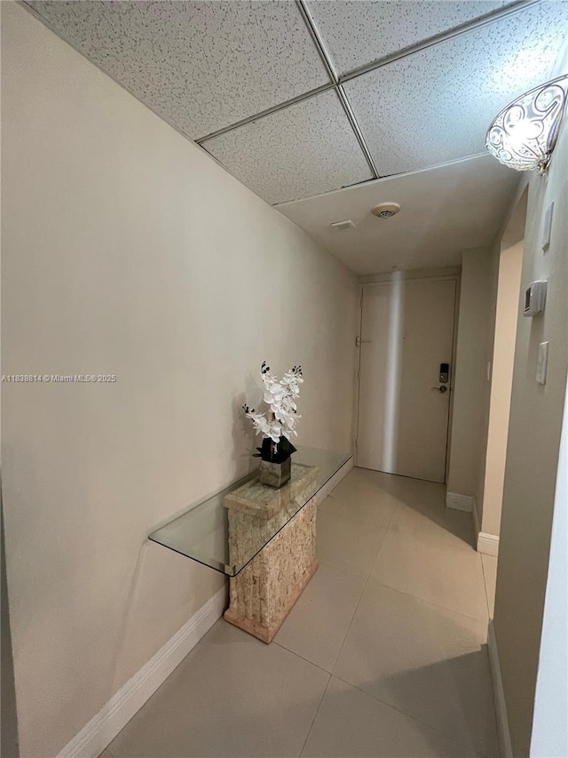 19390 Collins Ave Unit 902, Sunny Isles Beach, FL 33160 - corridor featuring tile patterned floors and a drop ceiling