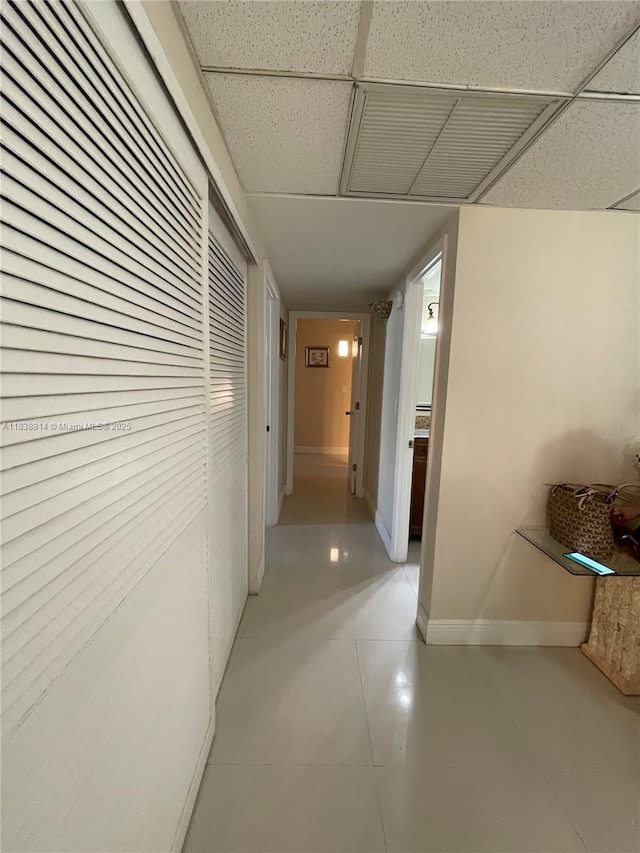 19390 Collins Ave Unit 902, Sunny Isles Beach, FL 33160 - hall with a drop ceiling and baseboards