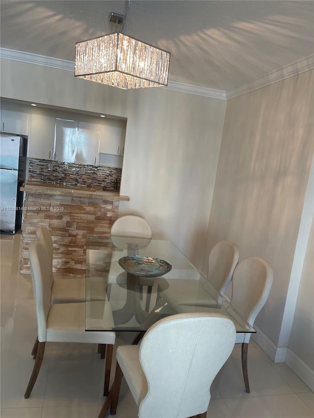 19390 Collins Ave Unit 902, Sunny Isles Beach, FL 33160 - dining area featuring ornamental molding, a chandelier, and tile patterned floors