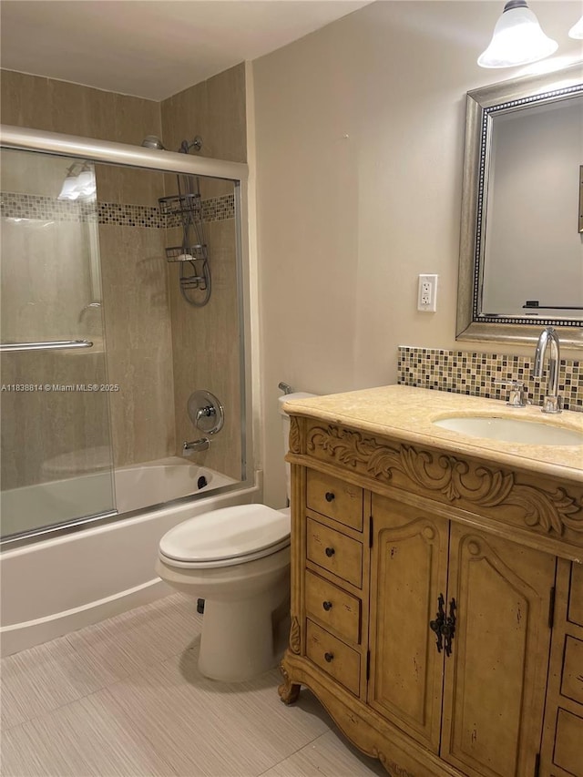 19390 Collins Ave Unit 902, Sunny Isles Beach, FL 33160 - bathroom with vanity, shower / bath combination with glass door, and tasteful backsplash