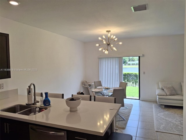 5990 Mustang Mnr, Davie, FL 33314 - kitchen featuring stainless steel dishwasher, light tile patterned flooring, a chandelier, light countertops, and open floor plan