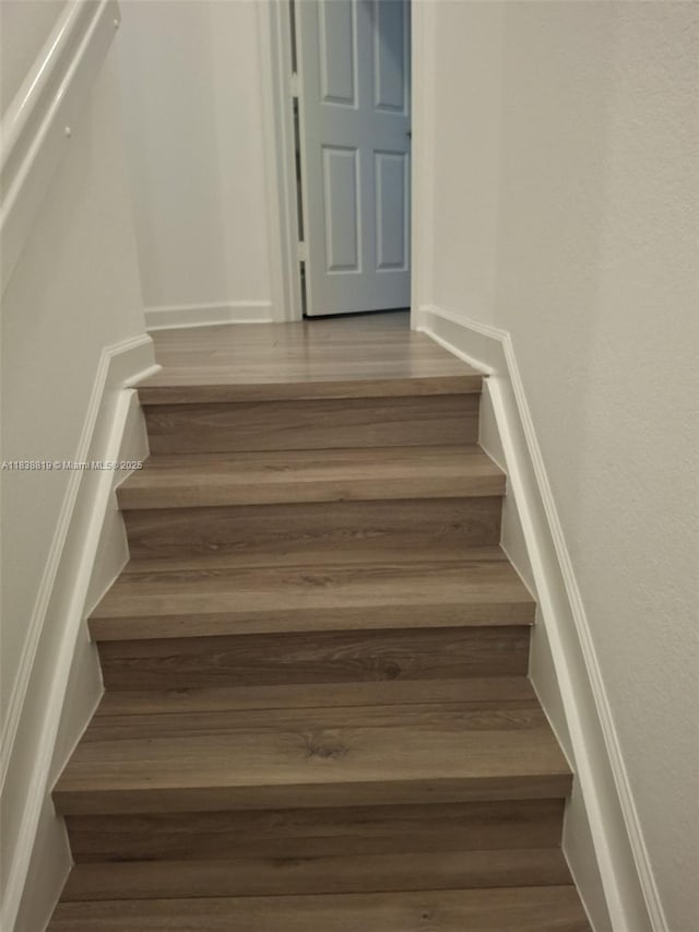 5990 Mustang Mnr, Davie, FL 33314 - staircase featuring wood finished floors