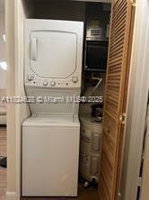 660 Cypress Club Way Unit F11, Deerfield Beach, FL 33064 - washroom with stacked washer and clothes dryer