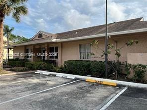 660 Cypress Club Way Unit F11, Deerfield Beach, FL 33064 - view of uncovered parking lot