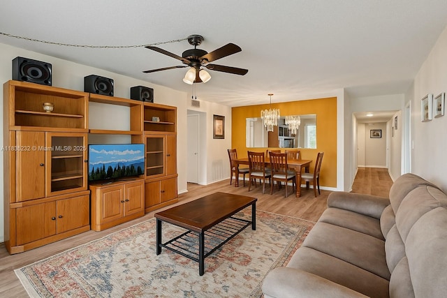 8103 NW 27th St Unit 1, Coral Springs, FL 33065 - living area with a chandelier, light wood finished floors, and ceiling fan