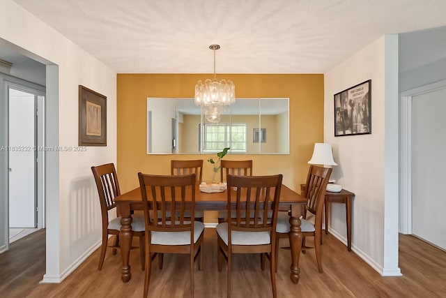 8103 NW 27th St Unit 1, Coral Springs, FL 33065 - dining room with wood finished floors and a chandelier