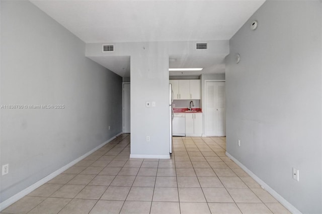 3410 Coral Way Unit 904, Miami, FL 33145 - spare room featuring a sink and light tile patterned flooring
