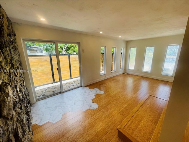 1930 NE 178th St, North Miami Beach, FL 33162 - empty room featuring hardwood / wood-style floors, plenty of natural light, and recessed lighting