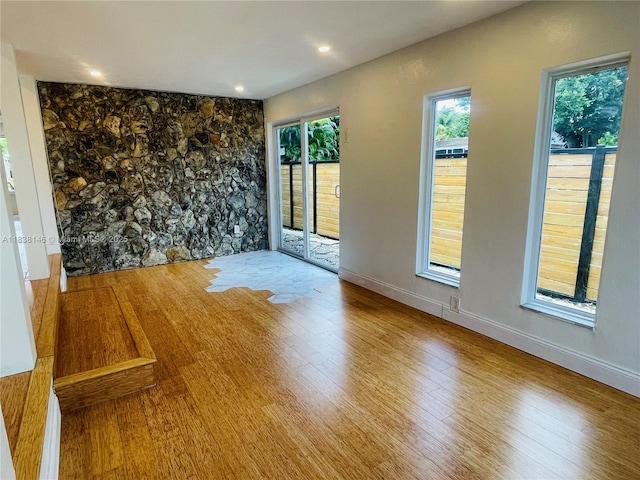 1930 NE 178th St, North Miami Beach, FL 33162 - empty room with wood finished floors, healthy amount of natural light, and recessed lighting