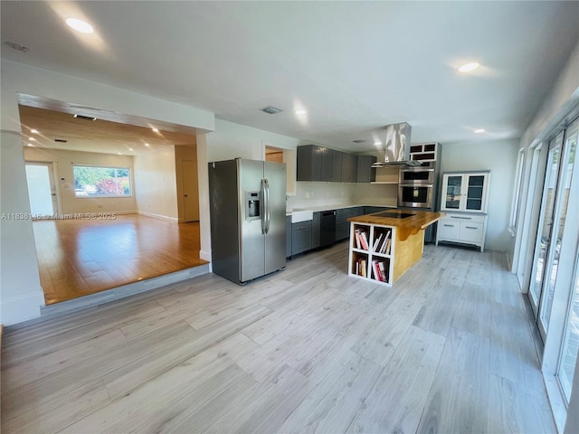 1930 NE 178th St, North Miami Beach, FL 33162 - kitchen with appliances with stainless steel finishes, open shelves, healthy amount of natural light, light wood-style flooring, and recessed lighting