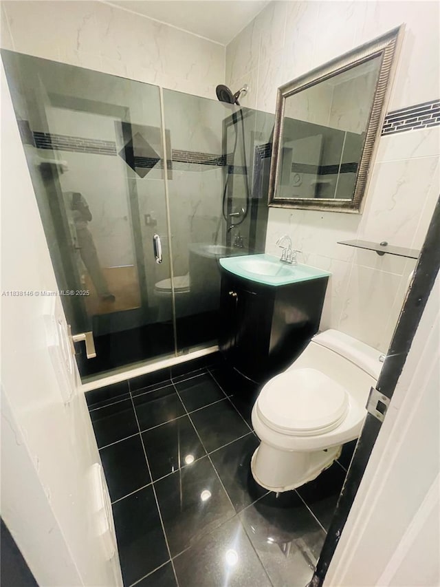 1930 NE 178th St, North Miami Beach, FL 33162 - bathroom with tile walls, a stall shower, and vanity