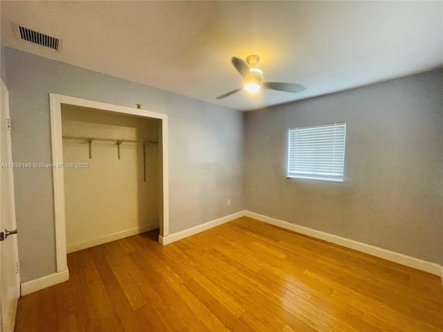 1930 NE 178th St, North Miami Beach, FL 33162 - unfurnished bedroom with light wood finished floors, a closet, and ceiling fan